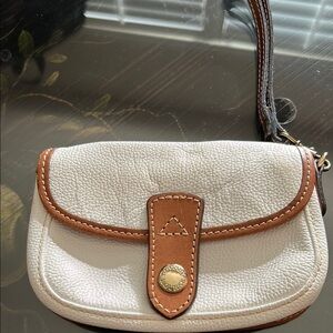 Dooney and Bourke Authentic Classic White and Tan Leather twist flap wristlet.